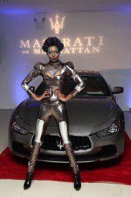 Model pose in front of the new Maserati Ghibli on display in the Maserati of Manhattan Showroom